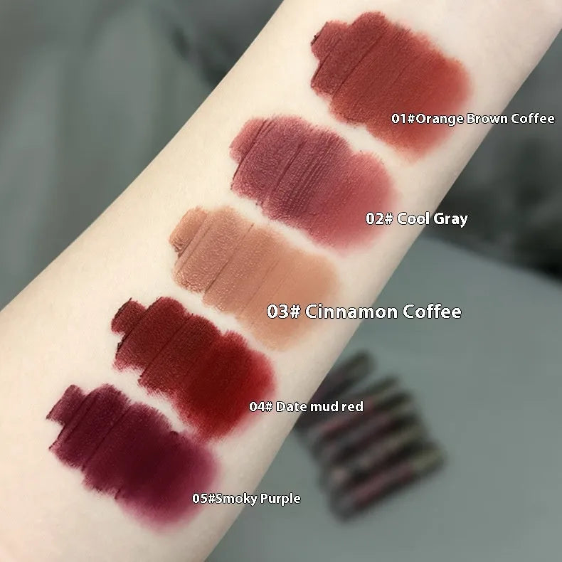 Lava Secret Matte Lip Mud Lipstick tube in one of five colours: orange brown coffee, cool grey, cinnamon coffee, jujube red, or smoked purple.