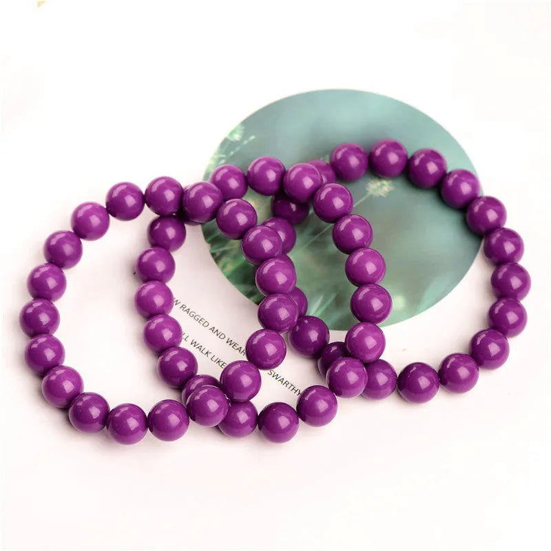 Genuine crystal bracelet with purple mica colour in a single circle design on a wrist.