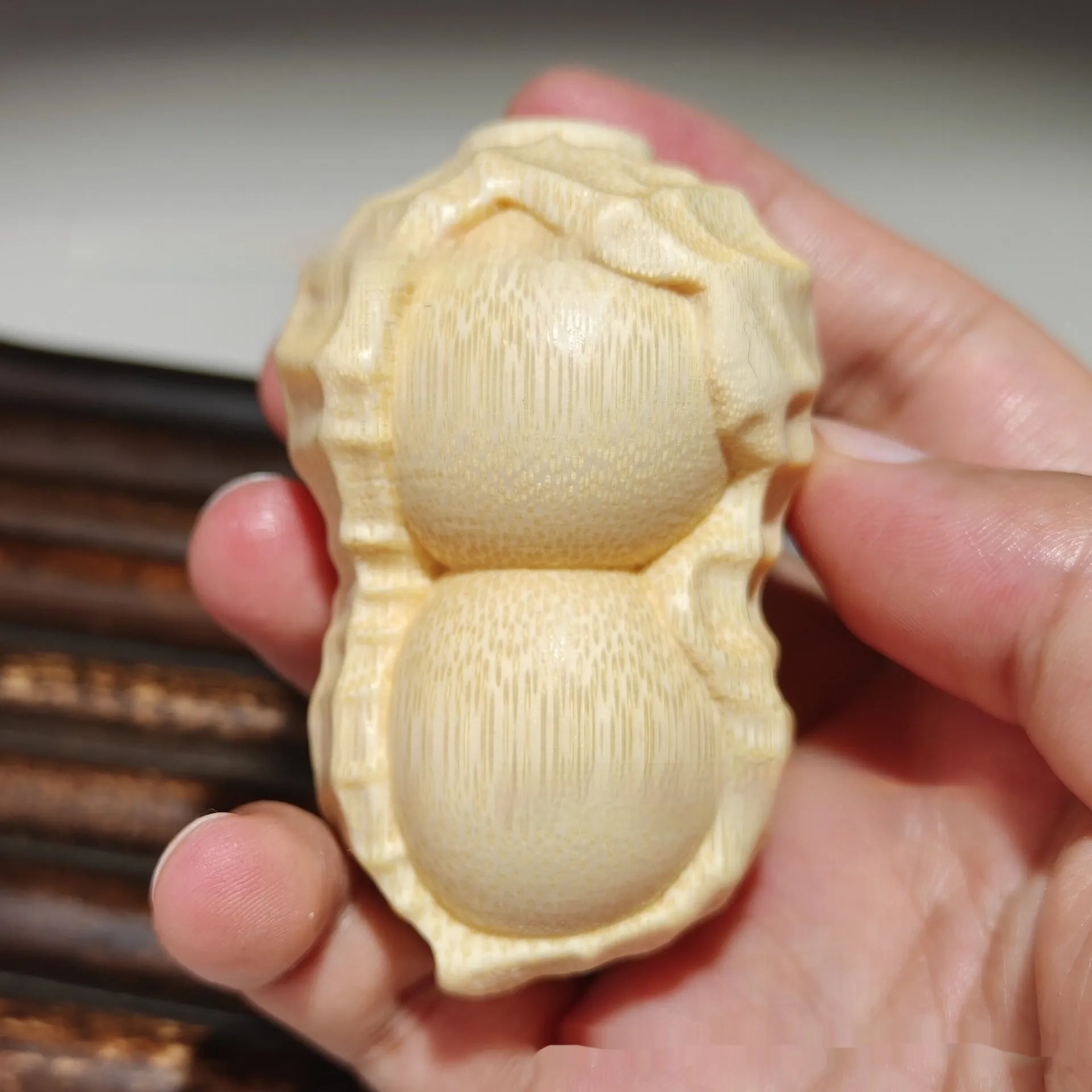Modern minimalist solid bamboo carving peanut ornament symbolising good fortune