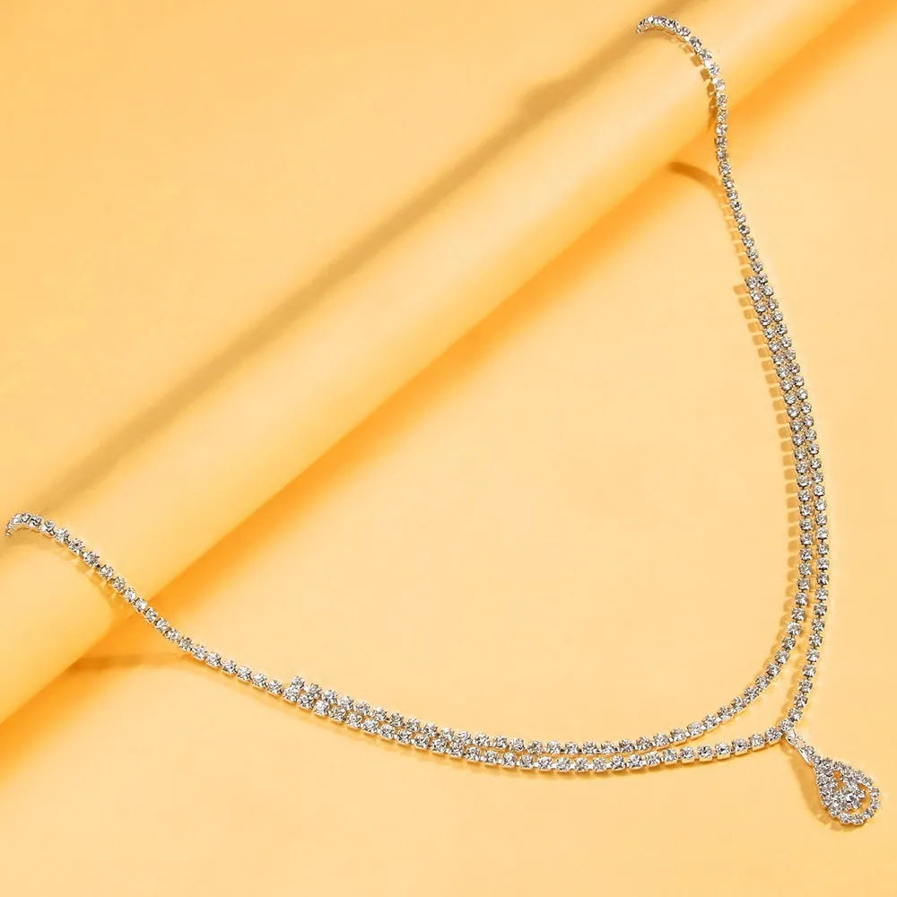 Gold and silver waist chain with water drop pendant and rhinestone decoration for women