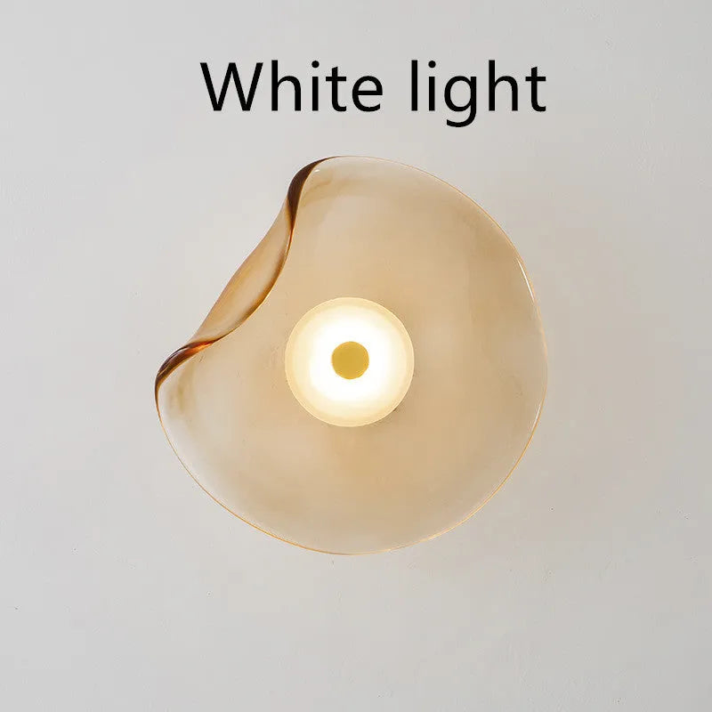 Round decorative wall lamp with glass shade for bedroom bedside lighting