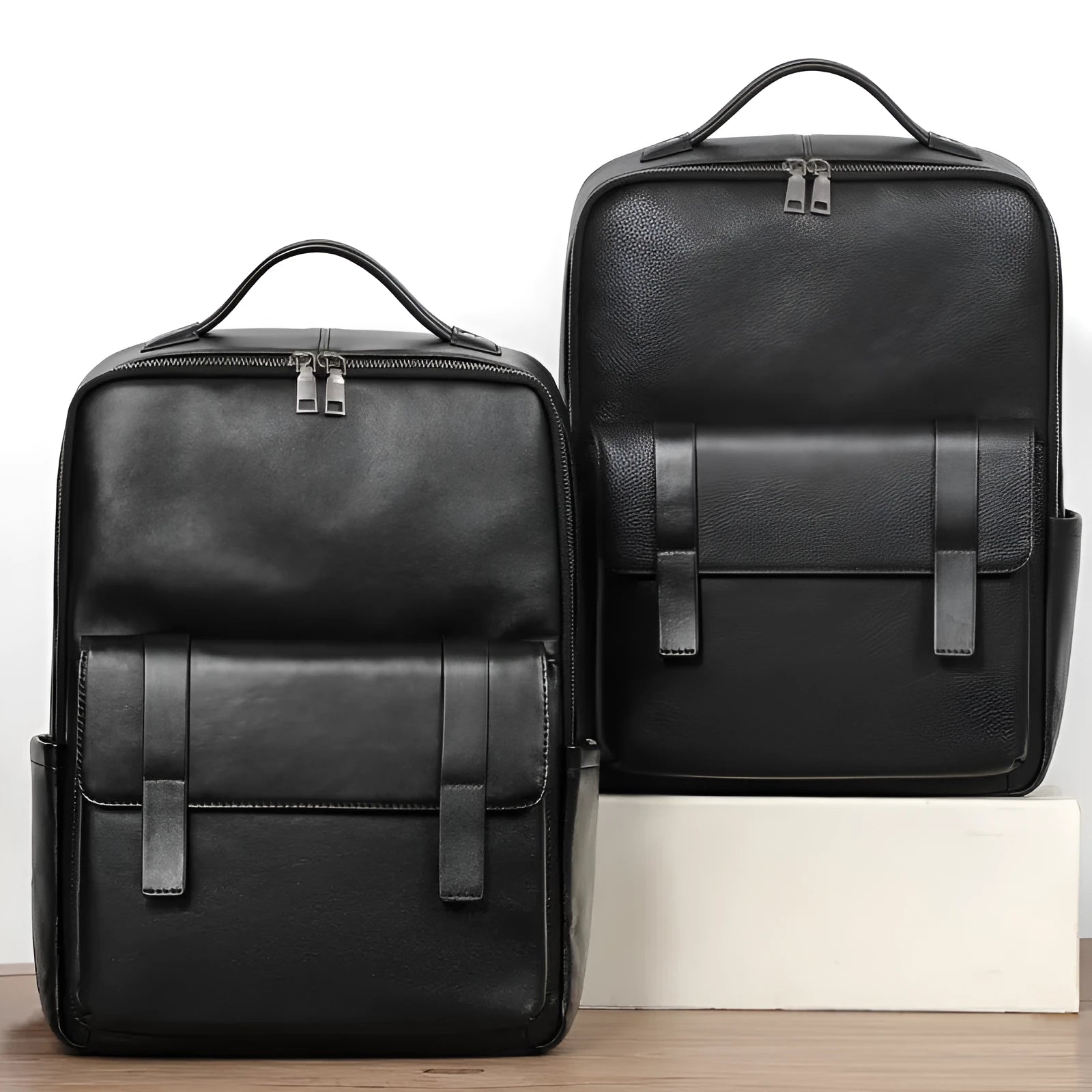 Black genuine leather men's business laptop backpack with 36-55L capacity showing weaving design details
