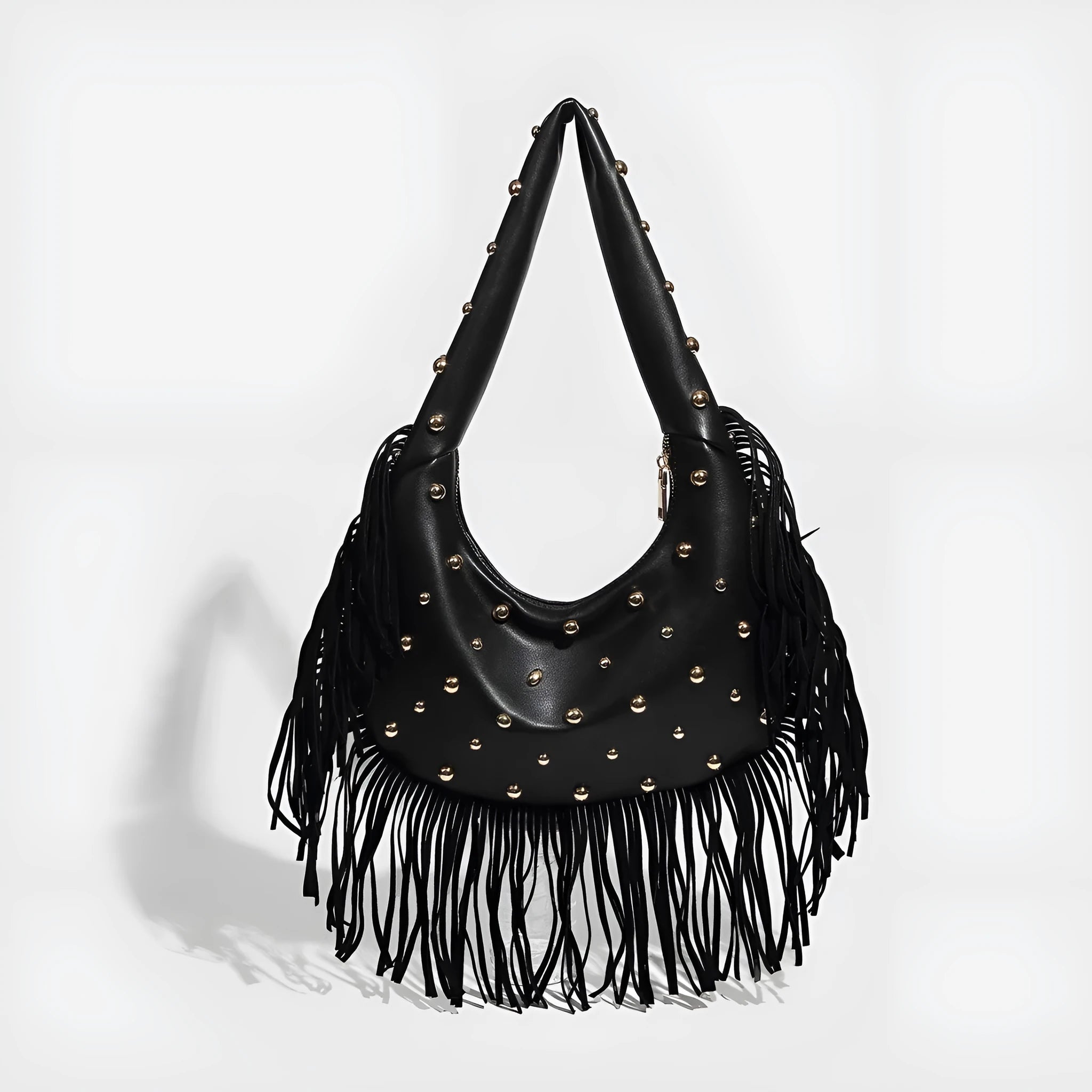 Retro black shoulder handbag with a long tassel decoration and an internal phone pocket.