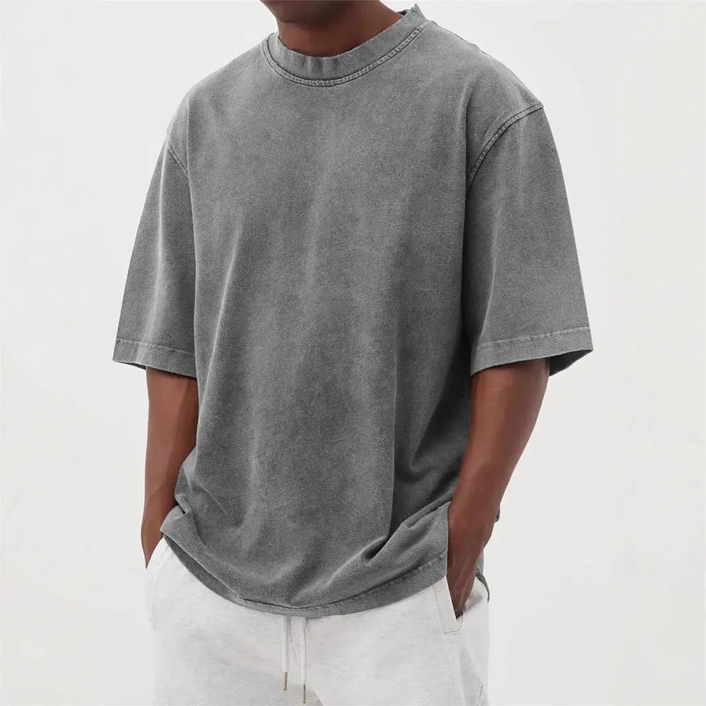 Men's washed distressed pullover t-shirt in solid colour with loose fit and stone washed finish