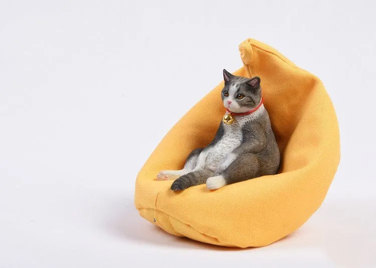 Lazy cat car ornament figure with sofa accessory on dashboard