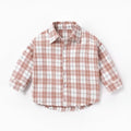 Boy's light blue cotton shirt with an animal print and lattice pattern, long sleeves.
