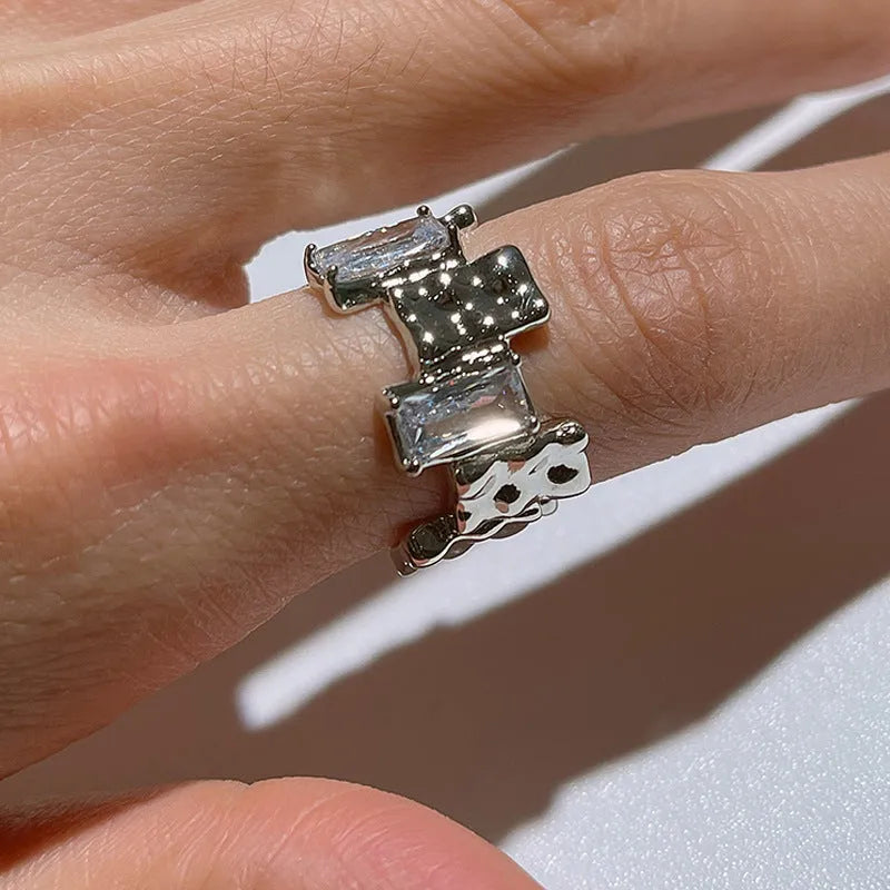 Silver cross zircon ring with open geometric design and three-dimensional decoration