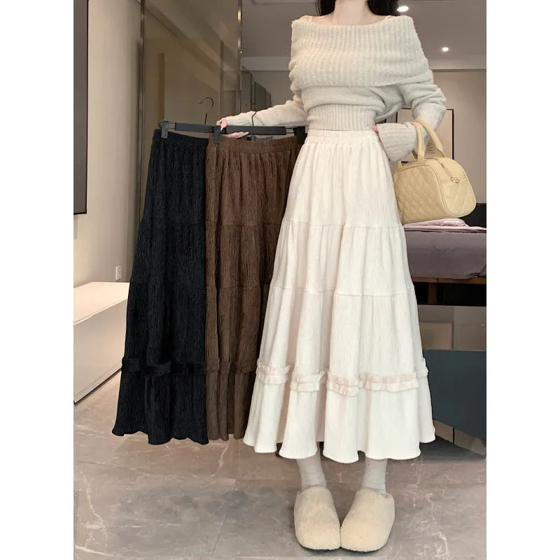 Corduroy A-line midi skirt with elastic waistband in beige, black or brown colours showing Korean style slimming silhouette