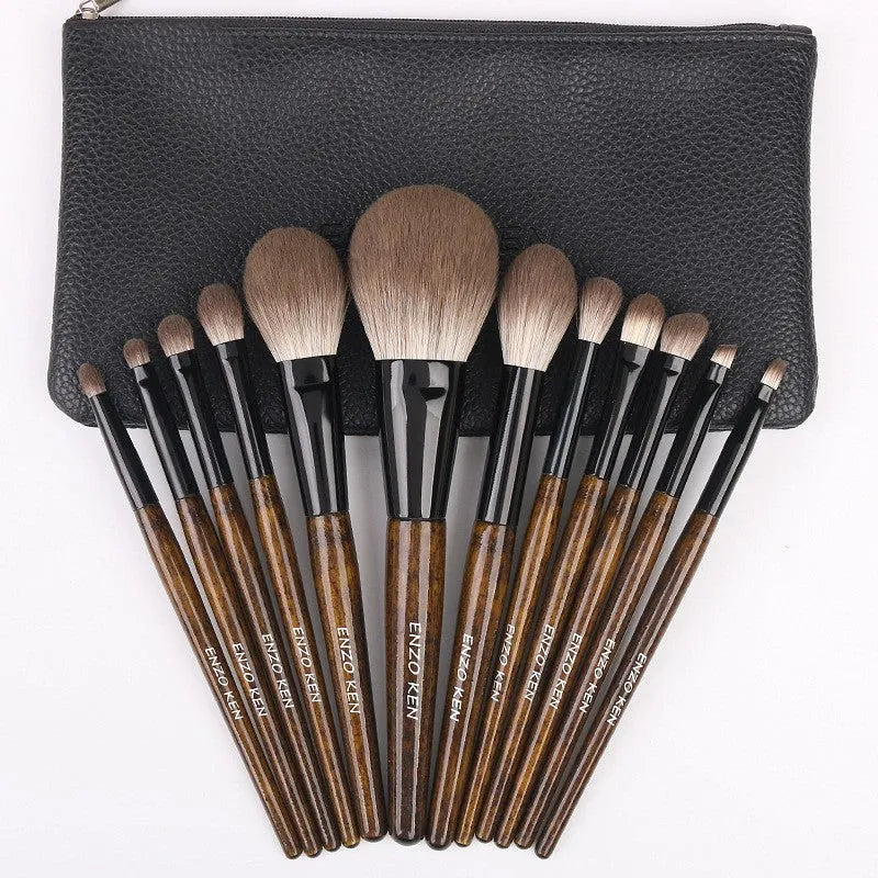 12-piece makeup brush set with wooden handles and a grey PU travel bag