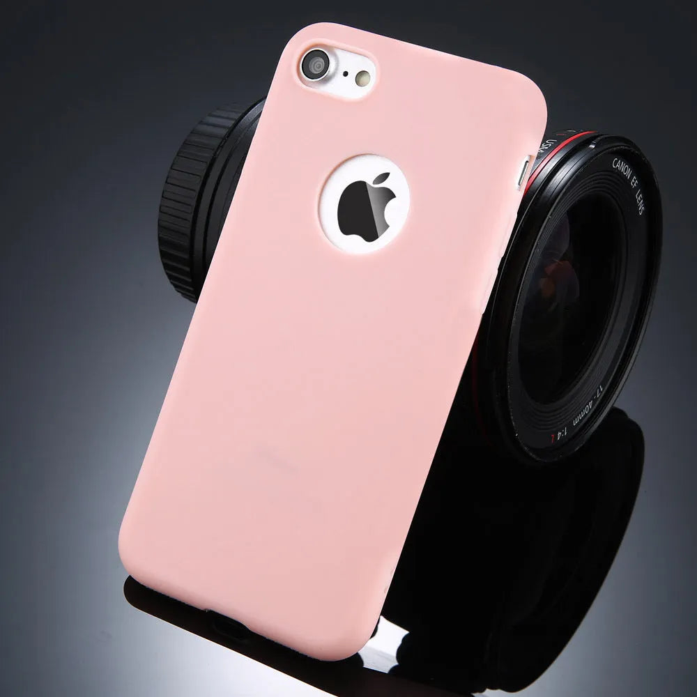 Candy colour soft silicon TPU back cover case for iPhone on a plain background.