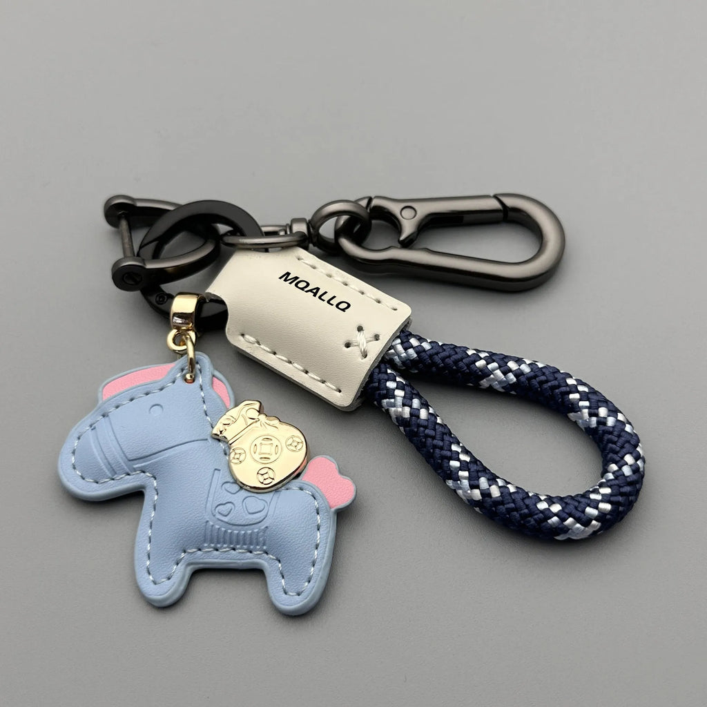 Handmade brown cowhide car key pendant with green flanelle rope and a metal buckle.