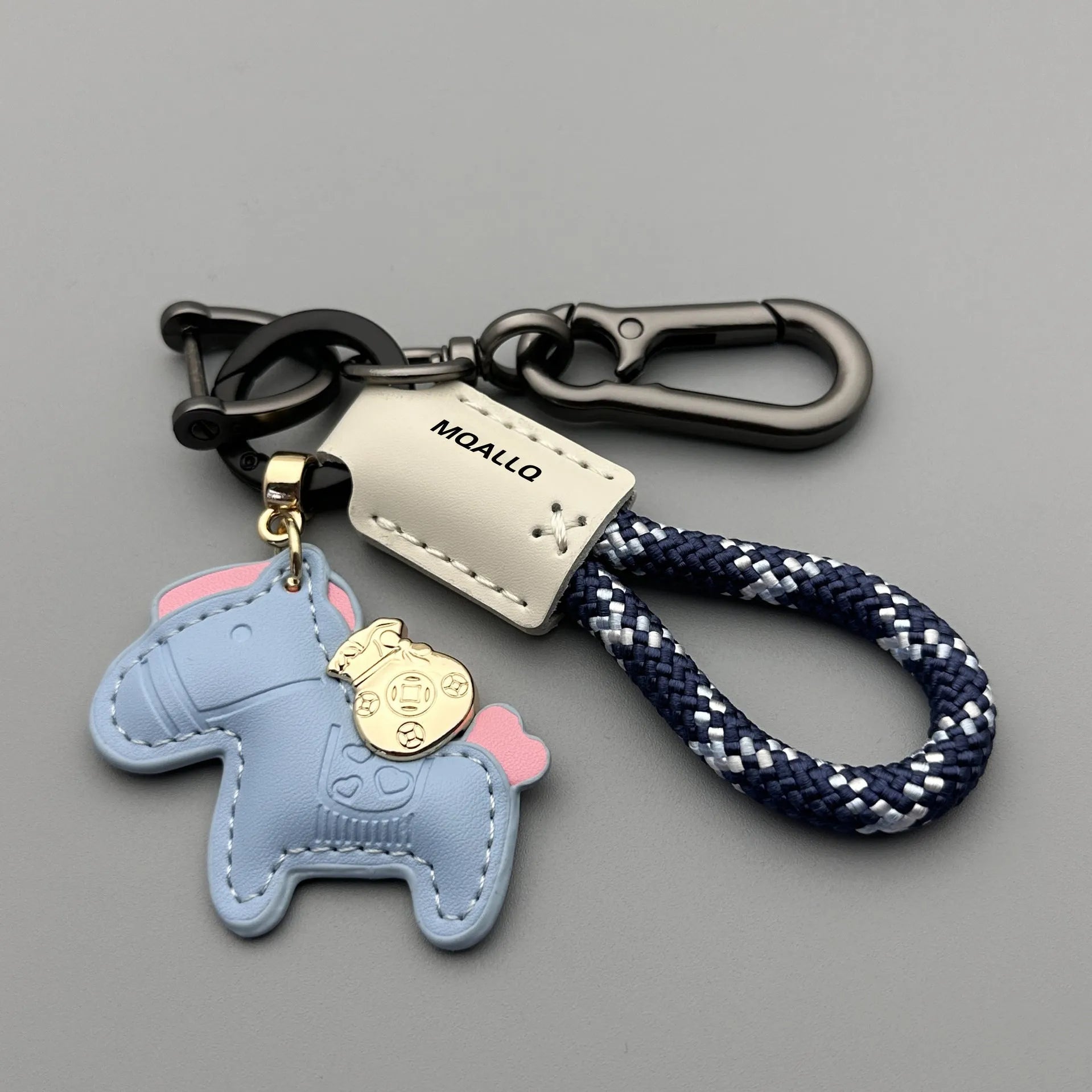 Handmade brown cowhide car key pendant with green flanelle rope and a metal buckle.