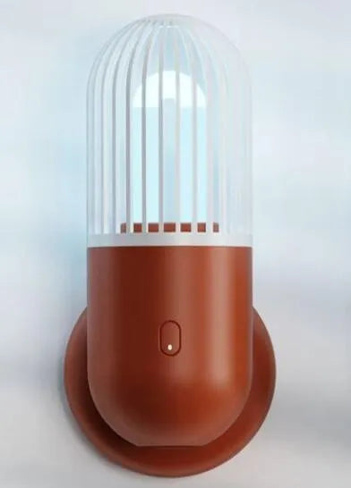 Portable capsule ultraviolet disinfection lamp in black, brown, green or white with display showing 52x52x136mm dimensions