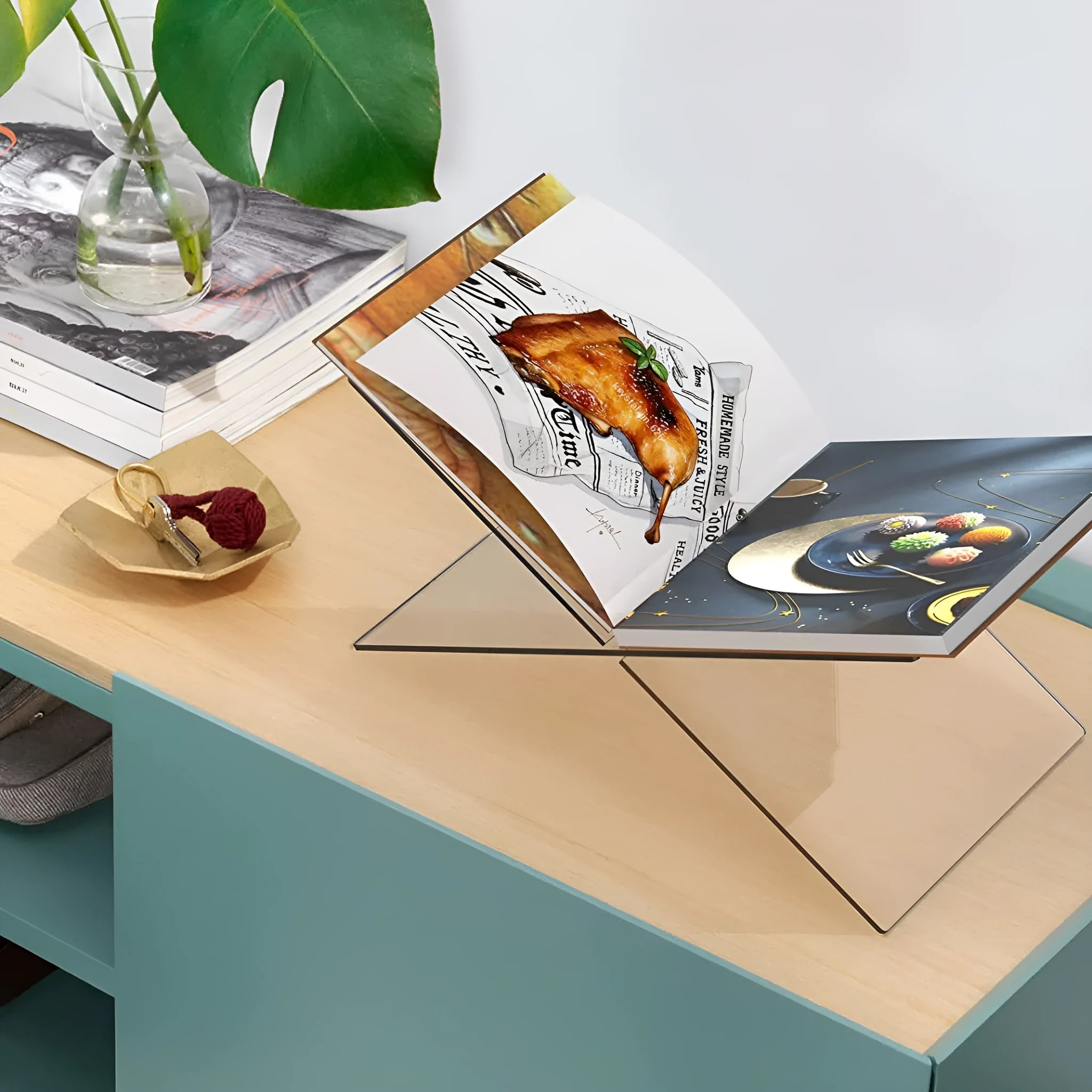 Clear acrylic X-type book reading rack displaying books upright on desktop