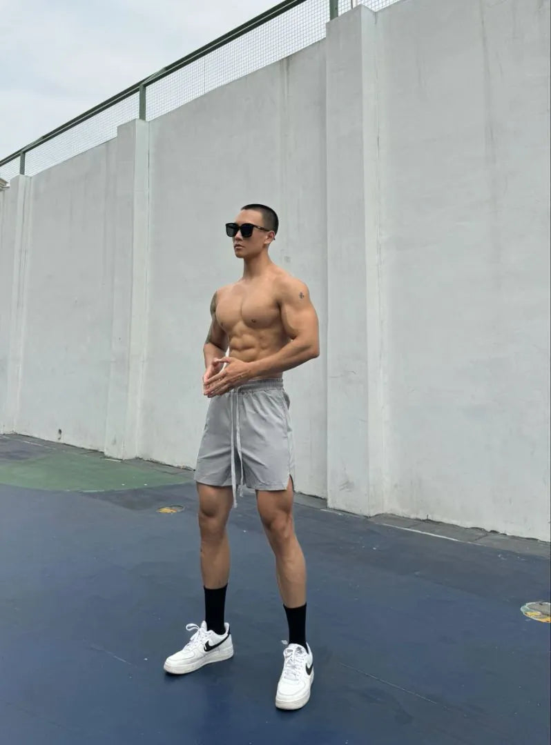 Men's ice silk quick-drying double-layer shorts in six colour options with quarter-length design