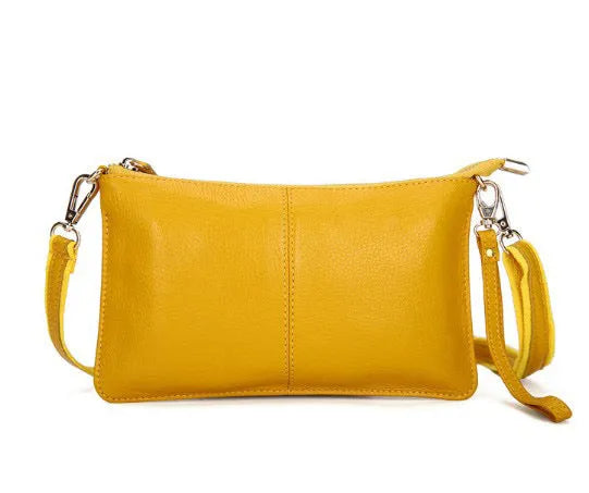 Lady cowhide slant bag in apricot showing top layer leather texture and dual straps