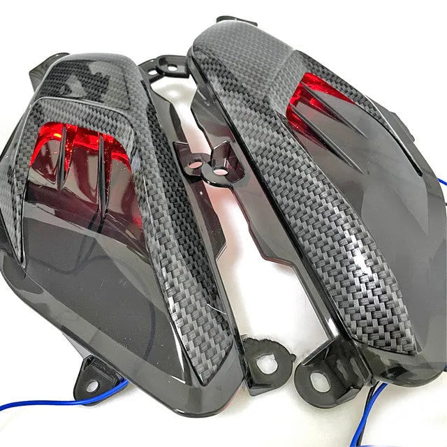 Pair of Yamaha NMAX LED side lamps with ABS plastic shell and choice of blue or red light.