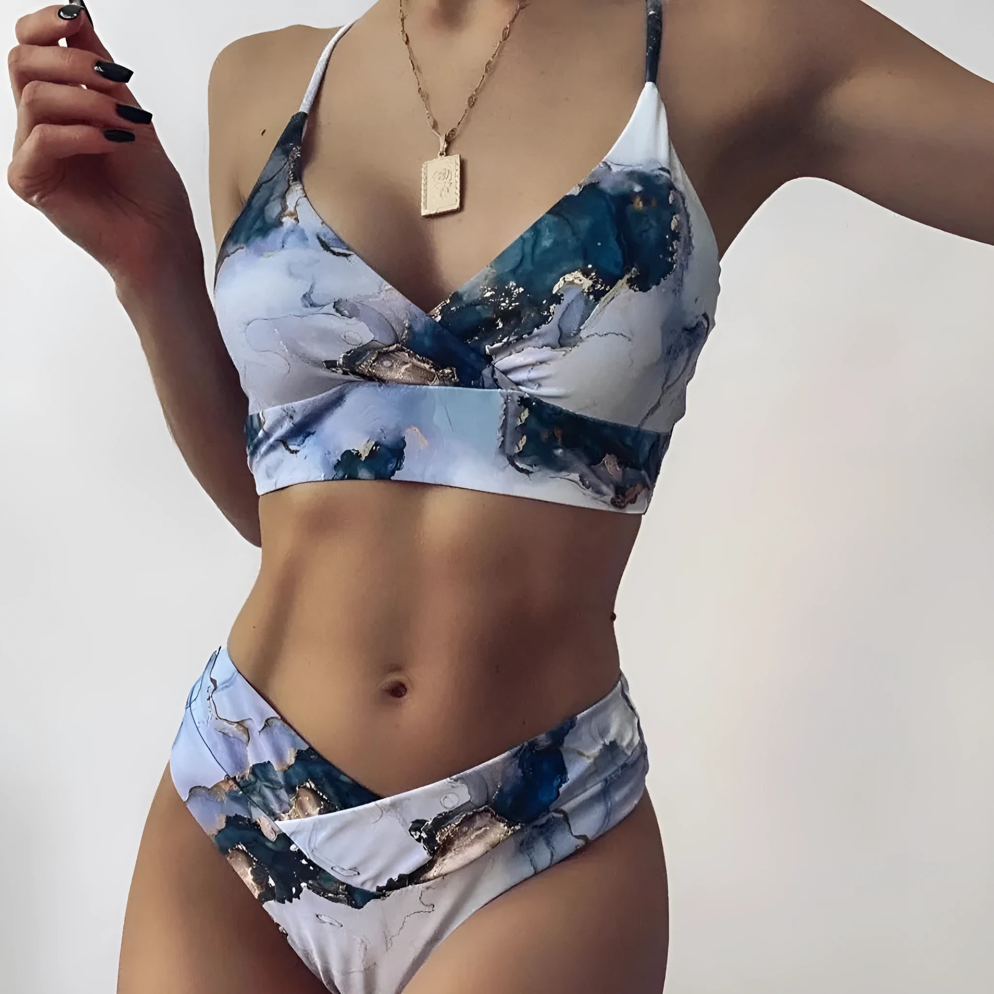 Women's high-waist marble tie-dye print bikini set with U-neck top.