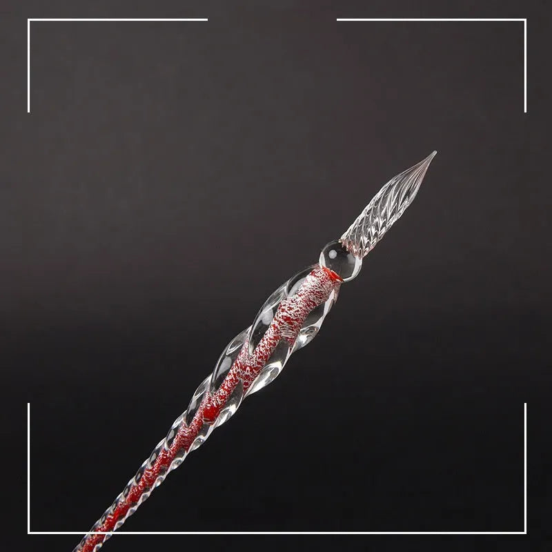 Transparent glass signature pen with coloured ink visible inside, abstract modelling, gift box packaging