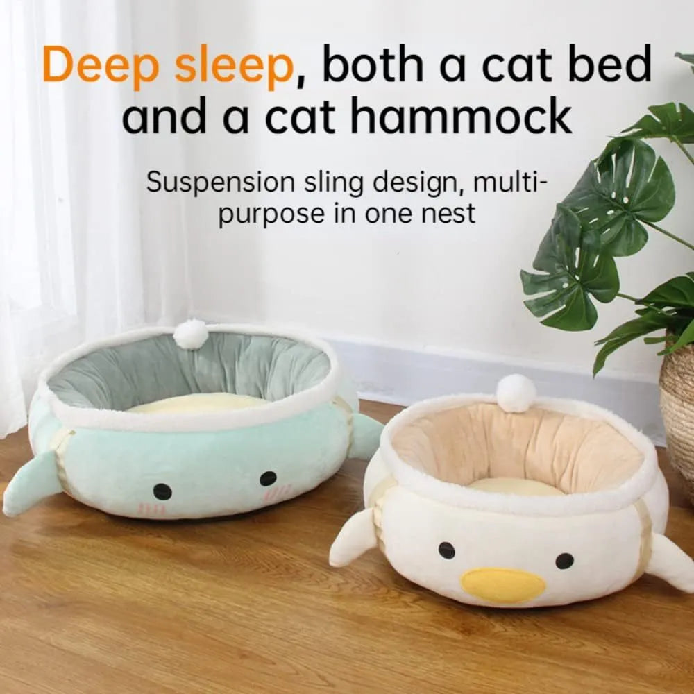 Green dinosaur and chick shaped cat bed shown both flat and hanging as a hammock