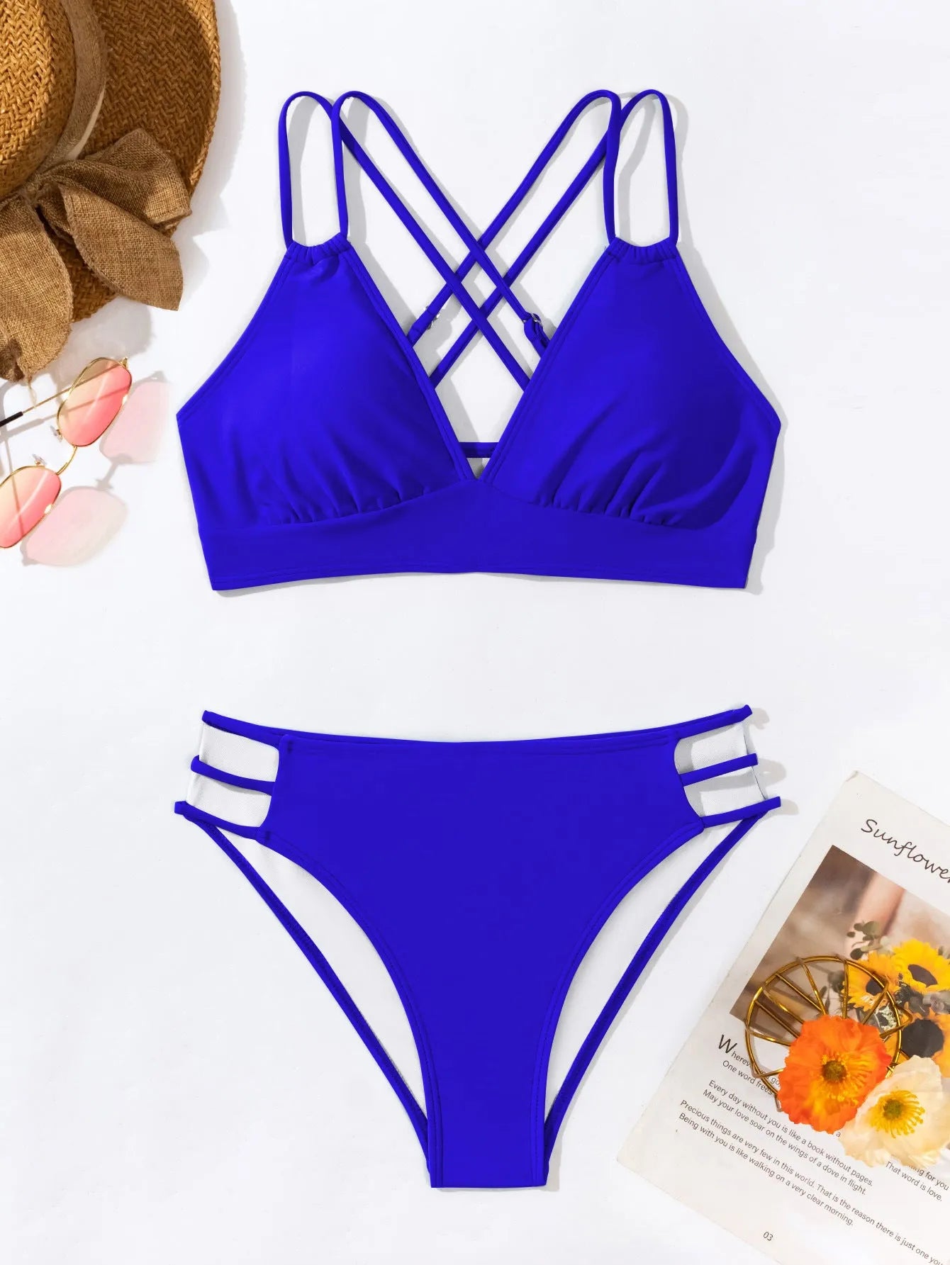 Women's black V-neck halter bikini with split-style shorts on a mannequin.