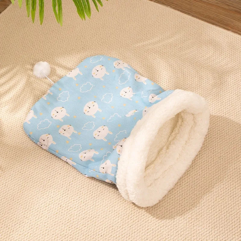 Blue rabbit print flannel cat sleeping bag nest measuring 50 by 40 centimetres.
