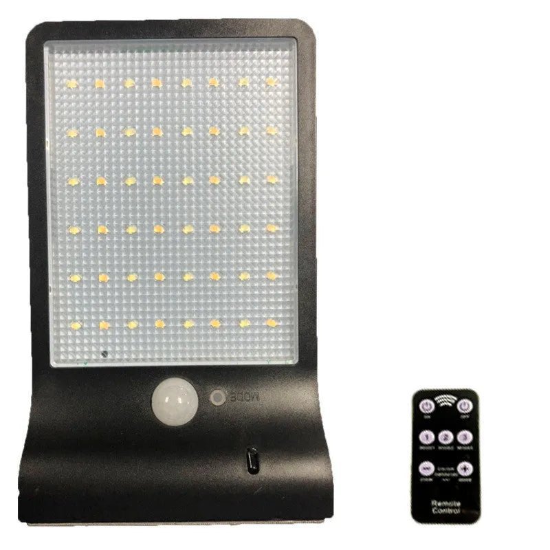 Black and white outdoor solar-powered garden light with IP65 waterproof rating for courtyards and balconies.