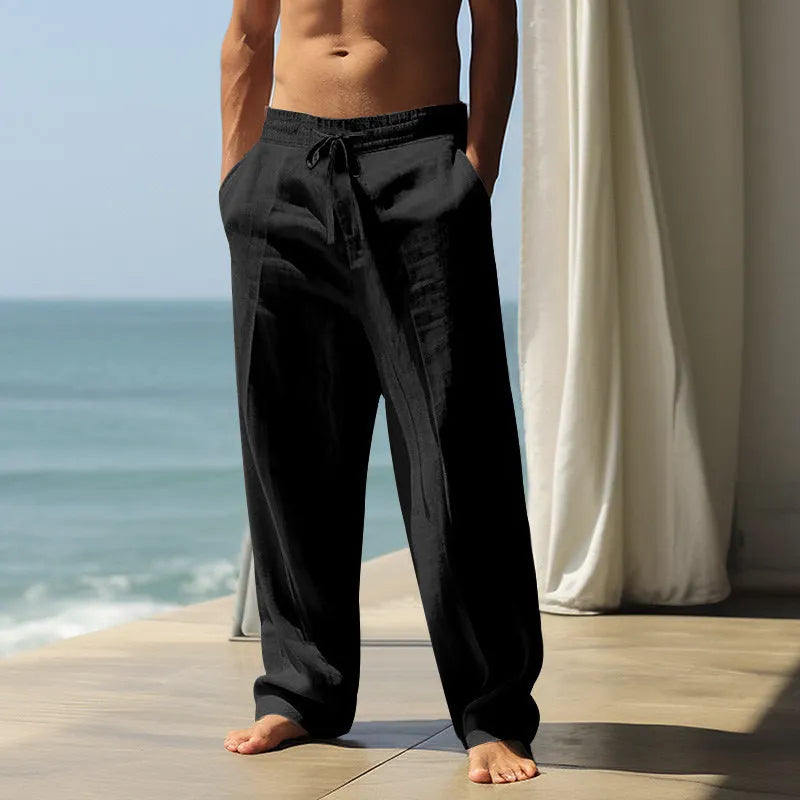 Men's cotton casual trousers with elastic waistband in seven solid colours showing loose fit design
