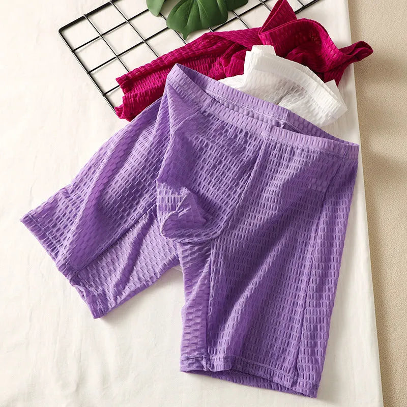 Men's solid colour lace boxers with a lengthened hip-lifting shaping design on a size chart.