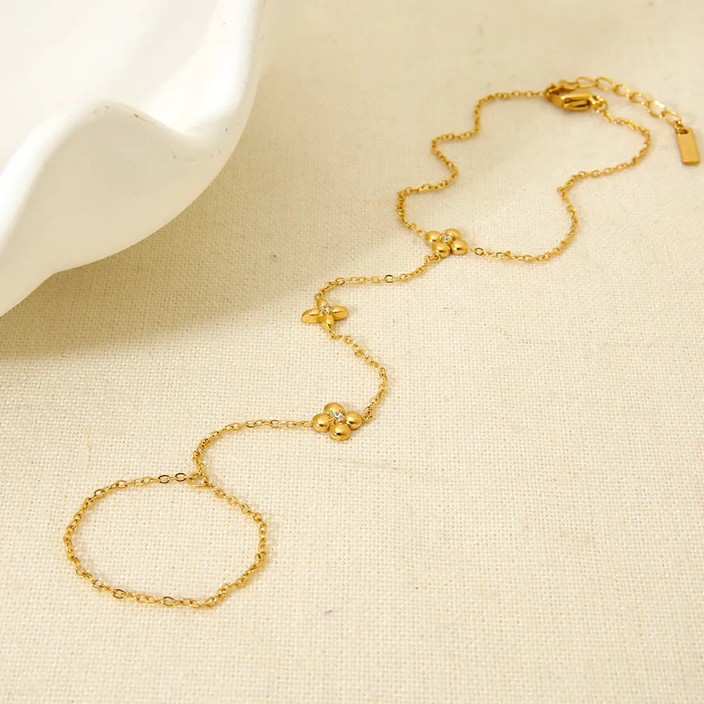 Gold stainless steel bracelet with eight-pointed stars and floral geometric design for women