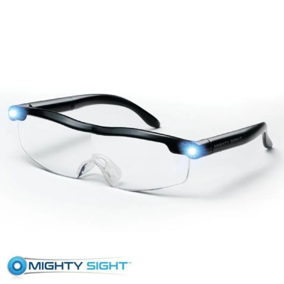Transparent black USB LED reading glasses with illuminated frames on a dark background.