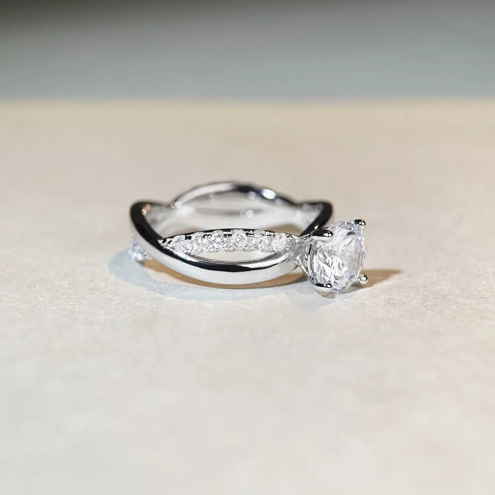 Silver geometric cross ring with 1 karat moissanite stone and twisted band