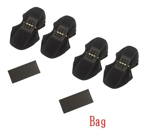 Adjustable black spring knee brace with straps and venting holes for sports support.