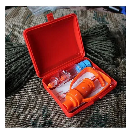 Orange portable venom extractor suction device kit open to show pump, suction cups, tourniquet and swabs.