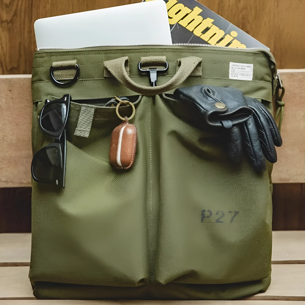 Canvas crossbody messenger bag in military green colour with shoulder strap and hard handle