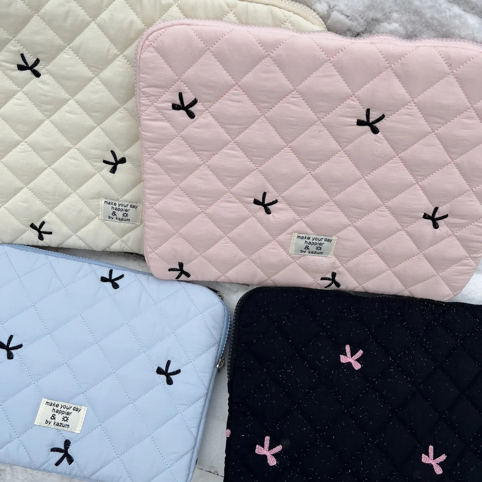 Laptop sleeve bag with rhombus embroidered bow in light blue colour