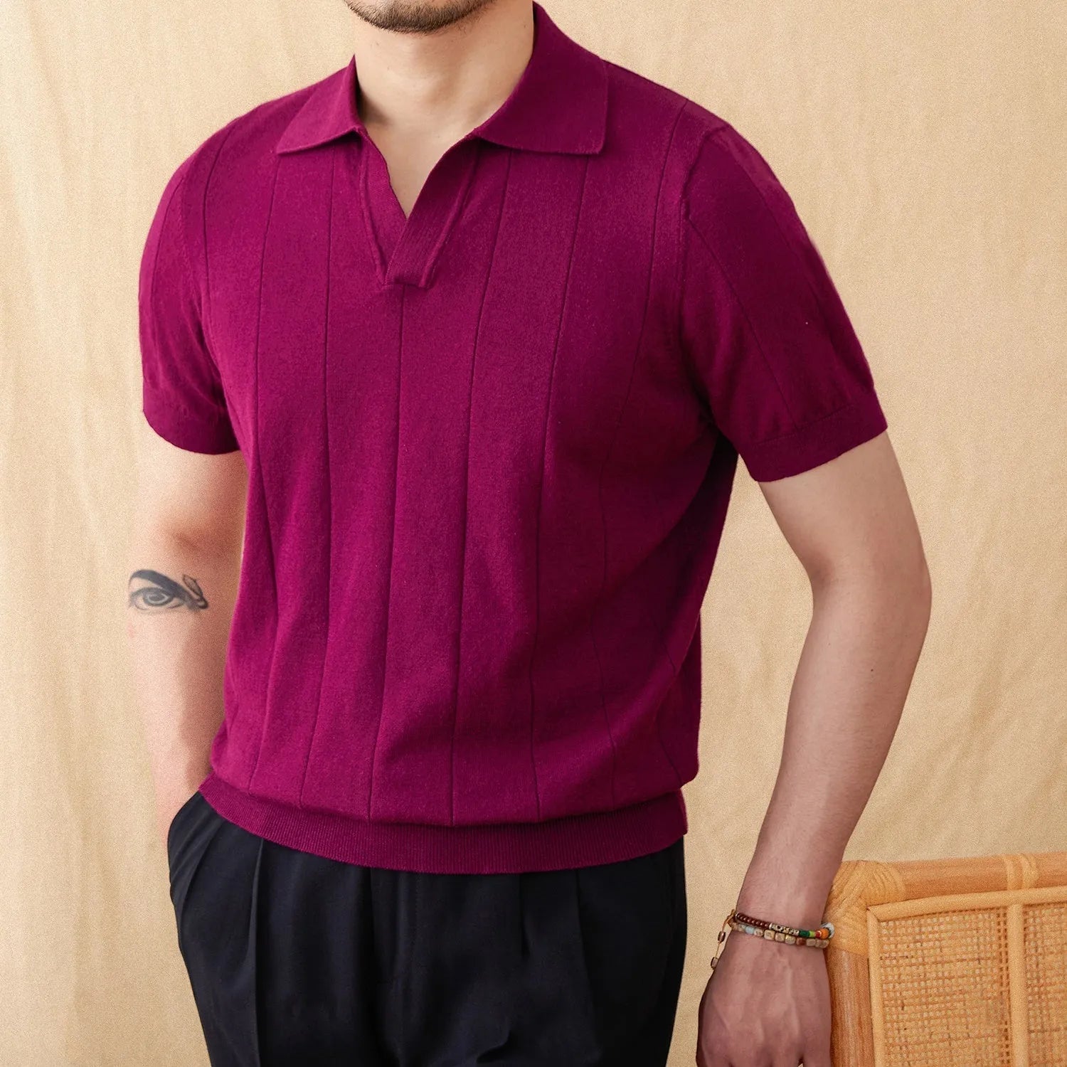 Men's purple sunken stripe knitted polo shirt with a seagull collar on a hanger.