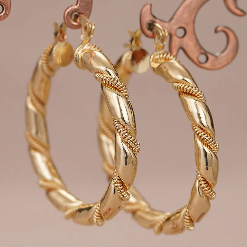 Geometric women's earrings with ring and line design in golden copper