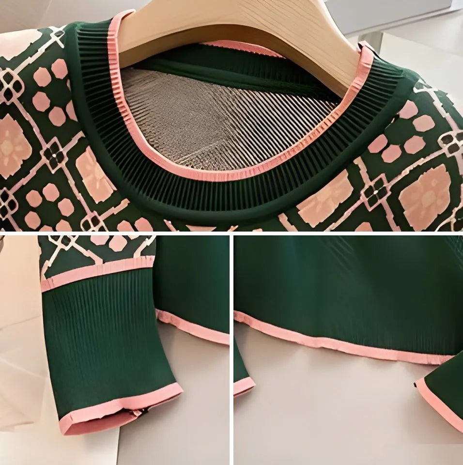 Green loose-fit printed sweater with regular sleeves on a hanger.
