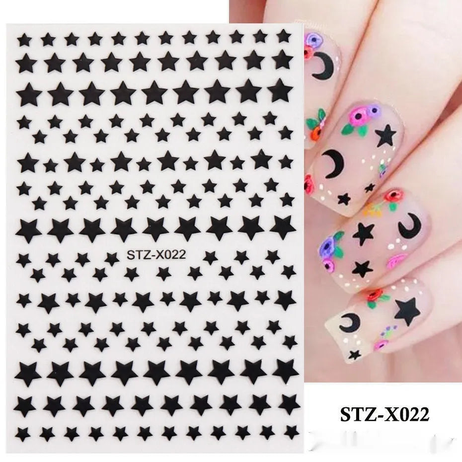 Sheet of black and silver love heart pattern nail art stickers with a plastic nail patch.