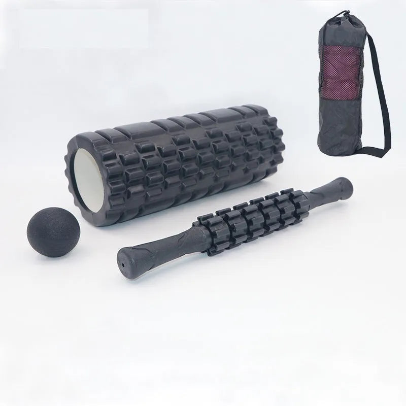 33cm long black foam roller massage stick with six raised gear pieces along its shaft.