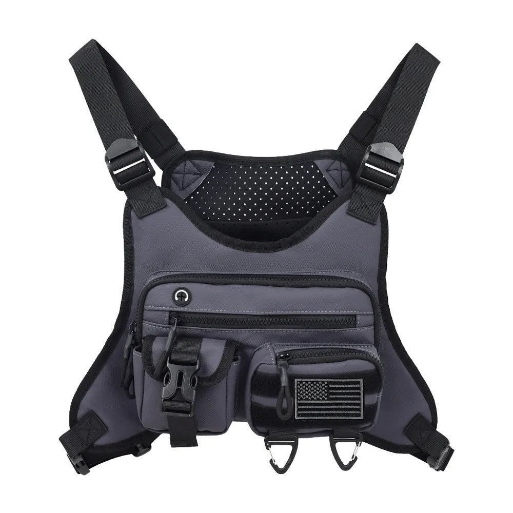 Men's black Oxford cloth chest bag worn as a vest, showing sewing line details and buckle closures.
