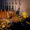 Solar garden lamp with tapered butterfly iron design and warm white LED light