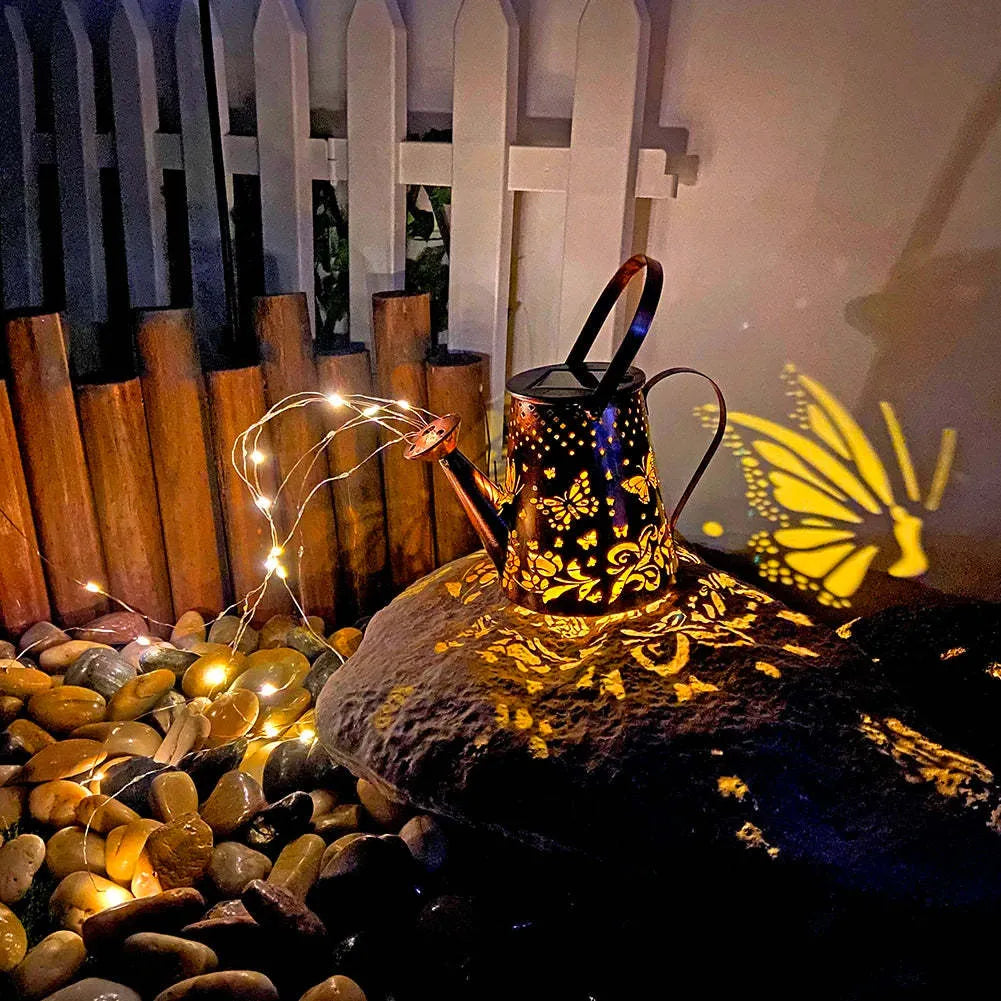 Solar garden lamp with tapered butterfly iron design and warm white LED light
