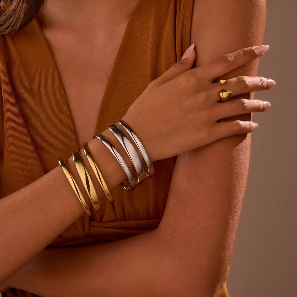 Stainless steel geometric line bracelet with simple opening clasp in gold or steel finish