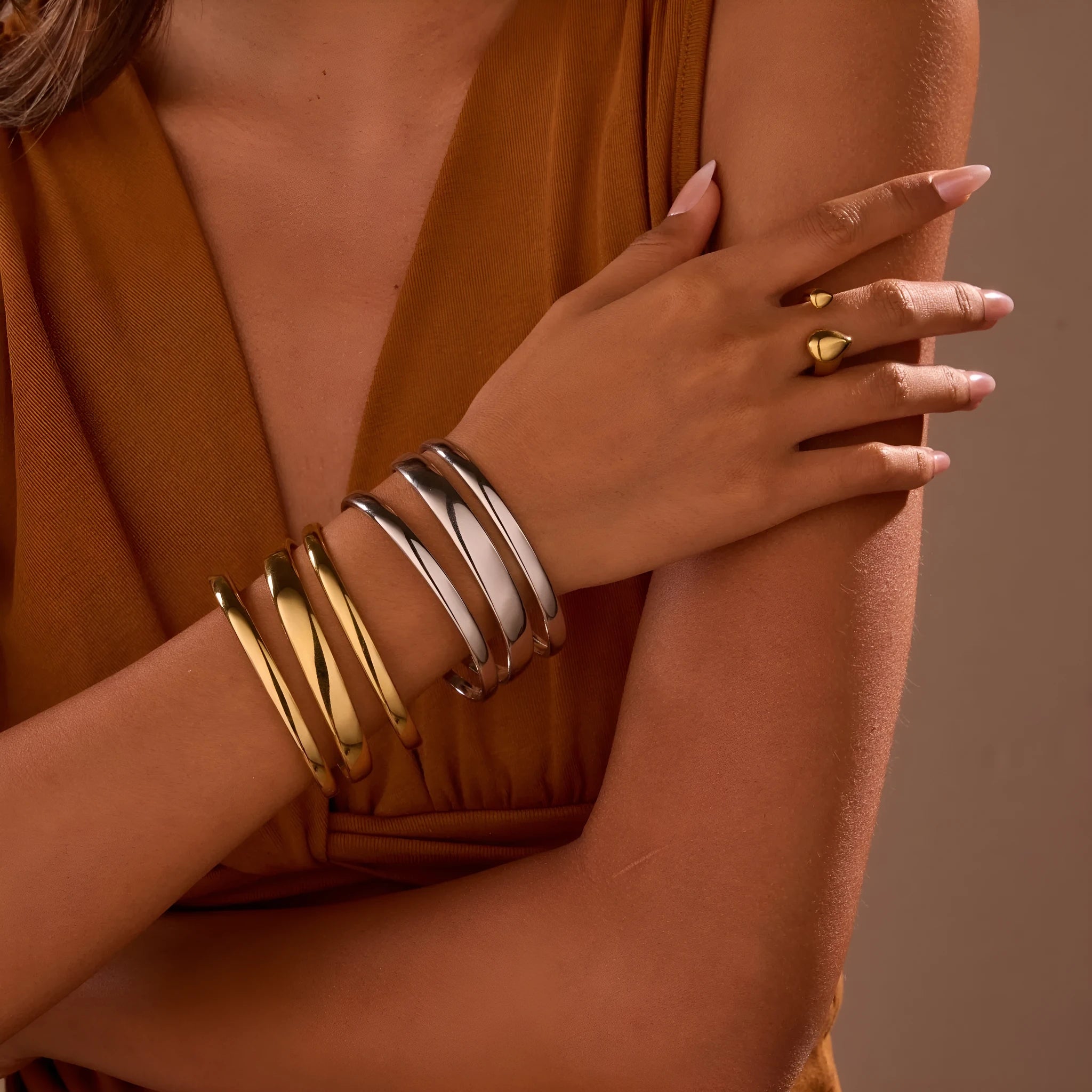Stainless steel geometric line bracelet with simple opening clasp in gold or steel finish