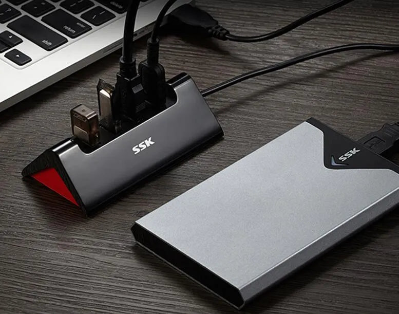 Black USB expansion dock with four ports and Micro USB connection in compact ABS housing