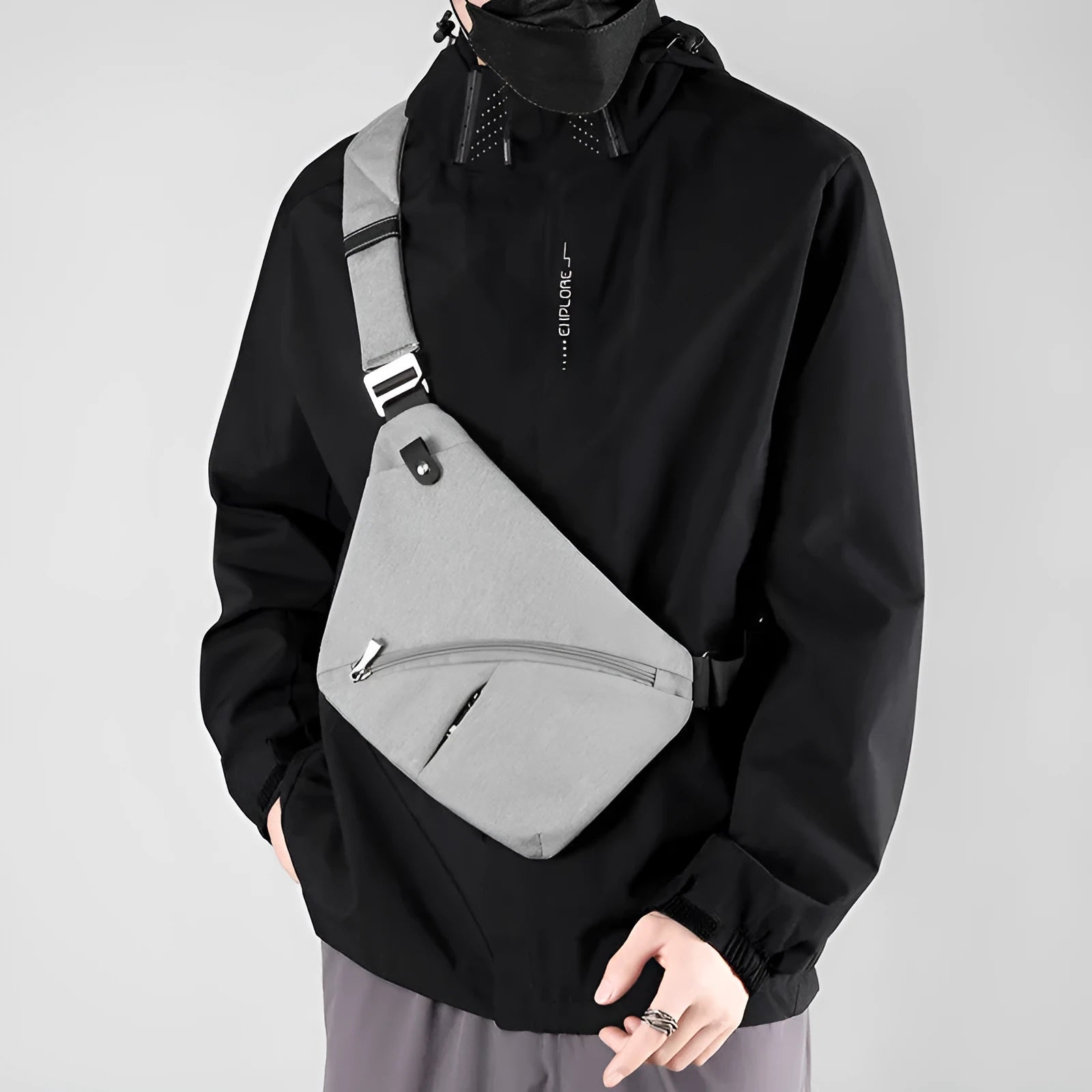 Men's grey oxford cloth chest bag with letter accents and single shoulder strap