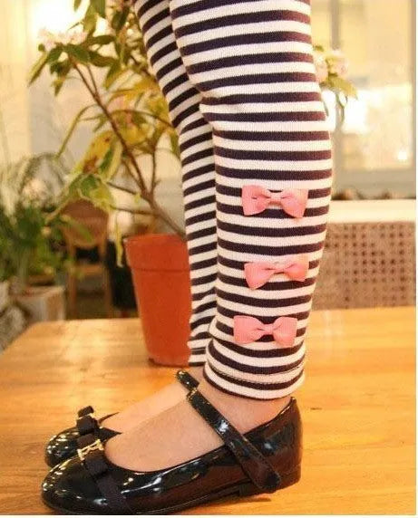 A pink two-piece cotton clothing set for a young girl, shown in sizes 110cm to 140cm.