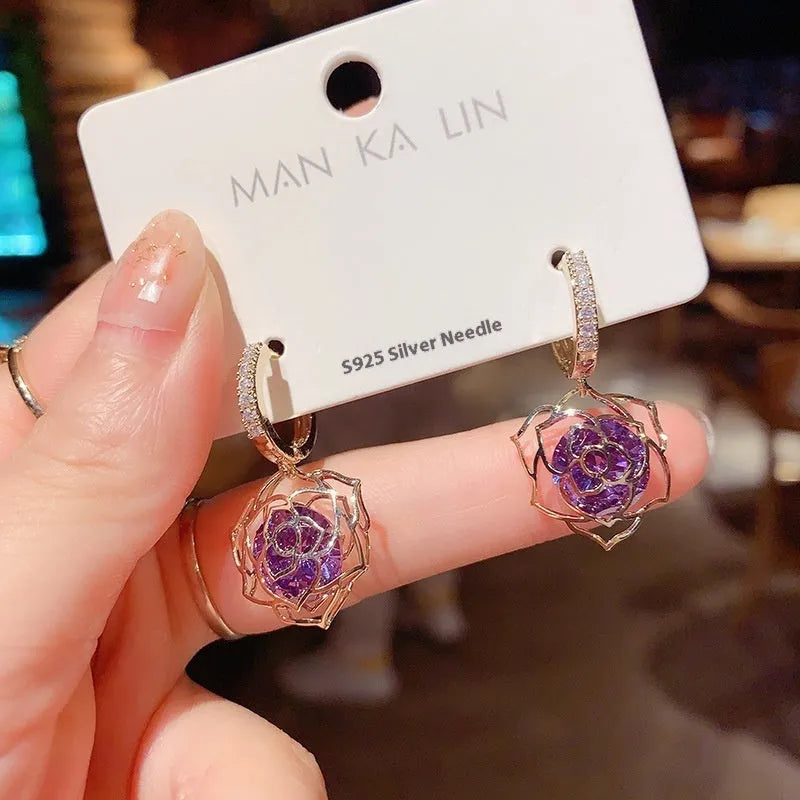 Geometric rose detail zircon earrings for women in copper, available in multiple colours.